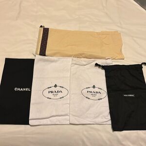 Assorted designer dust bags: Chanel, Prada, dolce & gabanna and Tory Burch